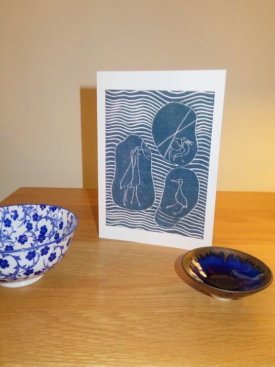 A lino print greetings card titled 'Pebble Birds'.