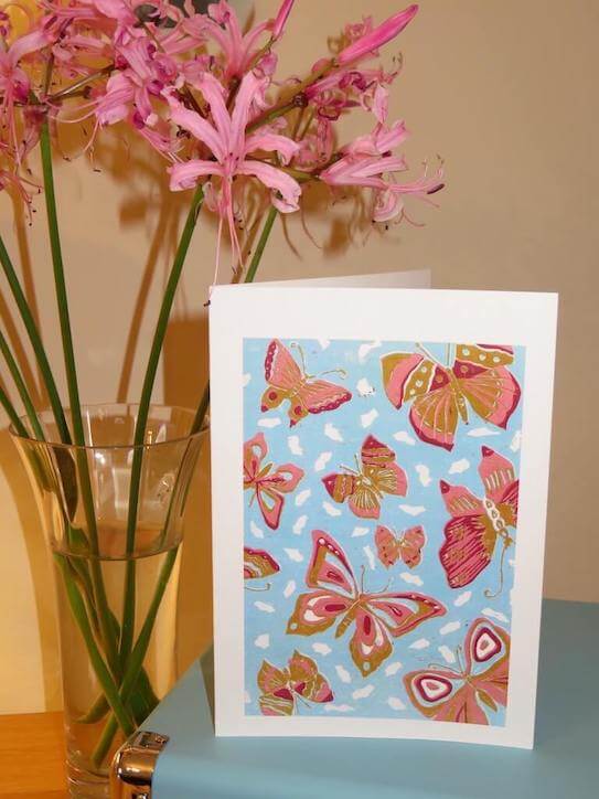 A lino print greetings card titled 'Butterfly Skies'.